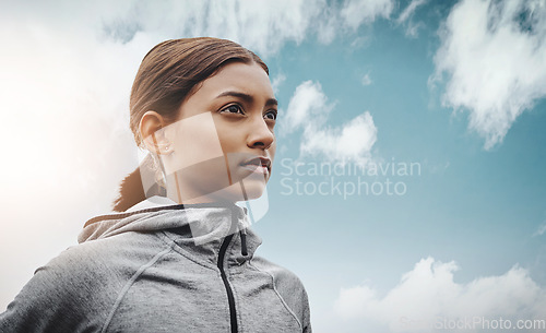 Image of Sky, runner and Indian woman with focus, training and exercise with workout goal, target and balance. Female person, mockup space and athlete with wellness, concentration and energy with cardio