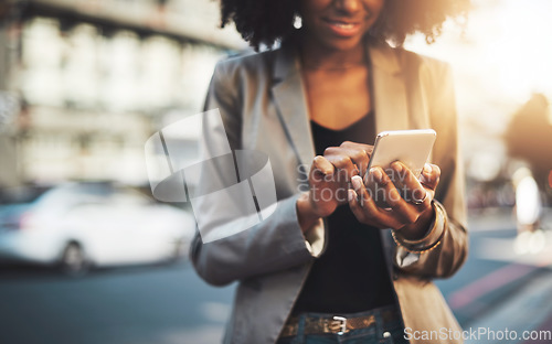 Image of Business woman, hands and phone in city for communication, social media or texting outdoors. Hand of happy female professional, smile and chatting, browsing or networking in street of an urban town