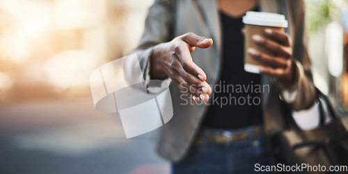 Image of Woman, handshake and meeting in city with coffee for greeting, introduction or hiring outdoors. Hand of female shaking hands for b2b, collaboration or agreement in deal or recruitment in urban town