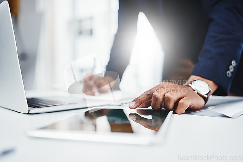 Image of Professional, man and laptop for research on tablet at work for analysis about career at desk. Businessman, hand and email for online at a workplace with a digital screen for communication on web.