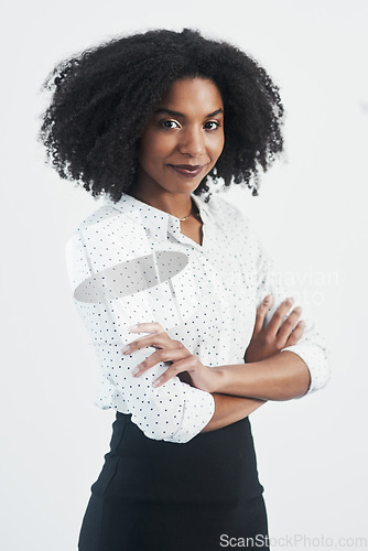 Image of Business, confident and portrait of black woman with arms crossed in studio isolated on a white background. Serious, face and African female professional, entrepreneur or person from South Africa.