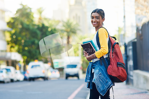 Image of City walk, books and portrait woman, happy student or person on commute journey to university, college or high school. Outdoor street, education and girl smile for learning, studying or scholarship