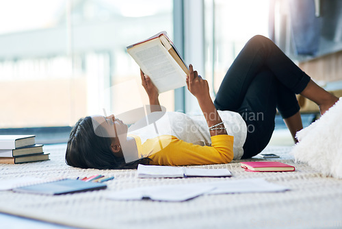 Image of Books, relax student and woman reading literature, research or book for home school education, study or college. Learning commitment, university and person studying knowledge while lying on floor