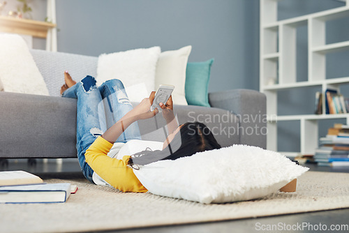 Image of Home communication, smartphone and woman typing, texting and search online, internet or app website. Living room floor, relax and person on cellphone, mobile application and message social media user