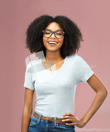 Image of Portrait, funny and black woman with glasses in studio isolated on a pink background akimbo. Natural beauty, nerd and face of African female model from Nigeria with confidence, cosmetics and fashion.