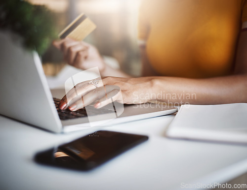 Image of Hands, laptop and business woman with credit card for ecommerce, deal or discount in home office. Online shopping, payment and female person with debit, banking or budget planning and finance