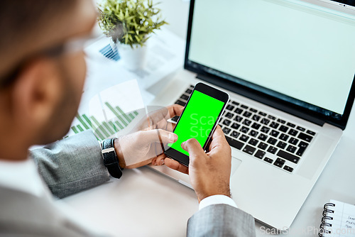 Image of Phone, green screen and man hands on laptop for mobile app mockup, data analytics and website design. Multimedia, technology and business person with smartphone mock up or space in office advertising