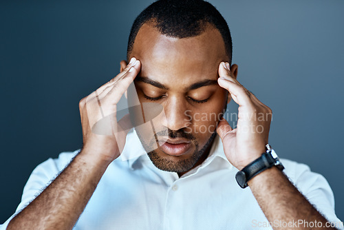 Image of Business man, headache and stress with hands massage temple, mental health problem and crisis with corporate burnout. Male professional face with pain, migraine and anxiety on studio background