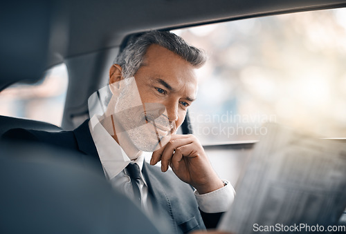 Image of Business man, reading newspaper and car for travel, journey or drive while thinking of news. Professional male person with media paper in passenger seat for work with luxury transportation or a taxi