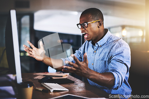 Image of African man in business, night and angry with computer glitch, stress with software problem and mistake. Male developer with anger, connection issue and working late, frustrated with 404 and crisis