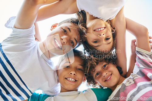 Image of Face, children and family circle or a group of happy siblings together or huddled in solidarity and smiling outdoors. Hug, brothers and sisters or excited kids play or bonding and united outside