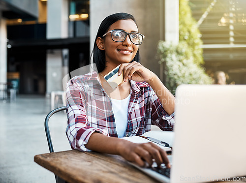 Image of Happy woman, student and thinking on laptop with credit card for ecommerce, payment or campus loan. Female person or university learner in thought on computer for online shopping, debit or banking