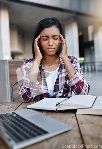 Image of Woman, student and headache in stress, anxiety or burnout from overworked or studying at campus. Stressed and tired female person at university with bad head pain, strain or ache with study books