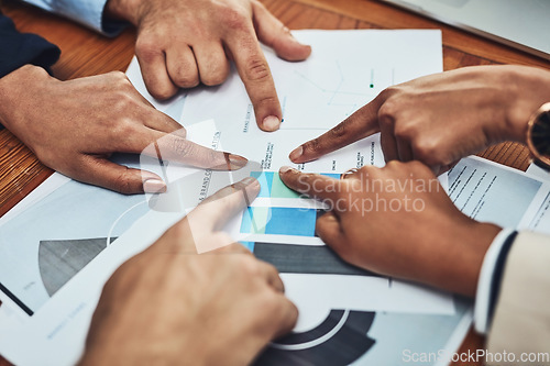 Image of Business people, hands and pointing to document in meeting for analytics, data or company statistics at office. Hand of employee group in corporate team analysis, paperwork or planning at workplace