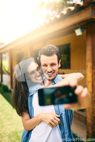 Image of Happy couple, hug and smile for selfie, profile picture or photo together in social media vlog outdoors. Man and woman hugging and smiling for memory, online post or capture outside their home