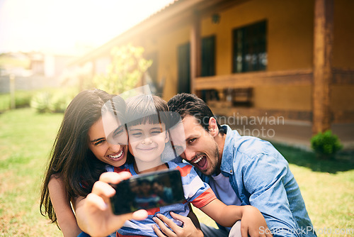 Image of Happy family, relax and smile for selfie, photo or profile picture in social media vlog outside home. Mother, father and child smiling for fun memory, online post or holiday weekend break together