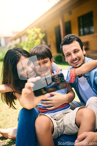 Image of Happy family, relax and smile for selfie, profile picture or photo in social media vlog outside home. Mother, father and child smiling for fun memory, online post or holiday weekend break together