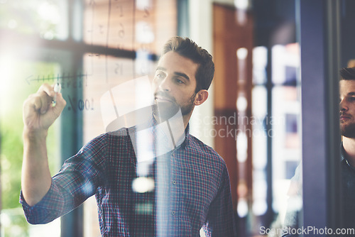 Image of Planning, board and businessman brainstorming in the office while doing research for a corporate strategy. Professional, writing and male employee working on a company project in workplace boardroom.