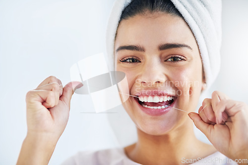 Image of Portrait, happy and woman with floss, dental and oral health with happiness, cosmetics and fresh breath. Face, female person or girl in a bathroom, cleaning or self care with morning routine or teeth