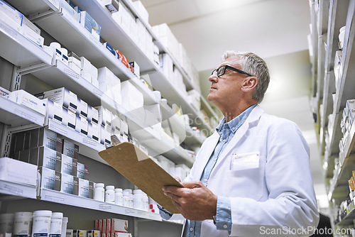 Image of Pharmacy, medicine and documents with man and clipboard in store for checklist, inspection and inventory. Medical, healthcare and pills with senior male pharmacist in clinic for wellness and product