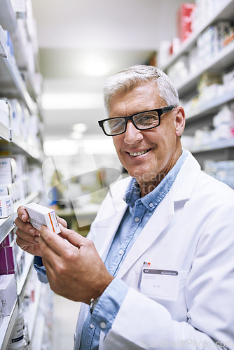 Image of Pharmacy, medicine and smile with portrait of man in drug store for search, inspection and inventory. Medical, healthcare and pills with senior pharmacist in clinic for retail, wellness and product