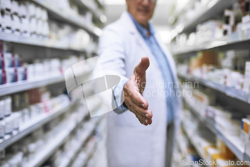 Image of Man, doctor and handshake at pharmacy for greeting, introduction or hello at healthcare clinic. Male person or medical expert shaking hands for health, pharmaceutical or medication advice at store