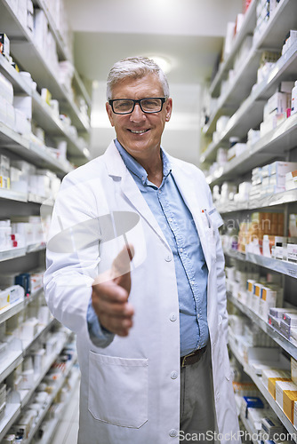 Image of Senior man, pharmacist and handshake for introduction or greeting at a healthcare pharmacy. Portrait of happy elderly male person or medical expert shaking hands in pharmaceutical for health advice