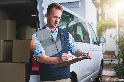 Image of Documents, delivery and a courier man with his van, checking a clipboard for an order or address. Logistics, ecommerce and supply chain with a male driver reading an inventory checklist for shipping