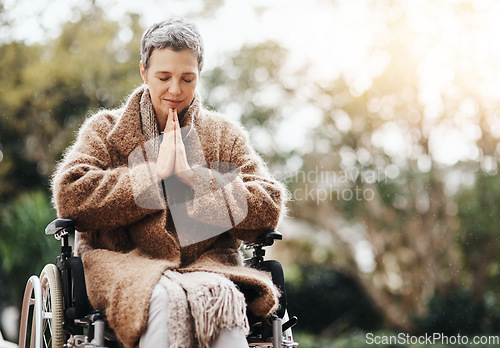Image of Senior woman in wheelchair, praying outdoor with worship and God with peace, disability with gratitude and faith. Spiritual female person in nature, mockup space and paralysis, disabled and prayer