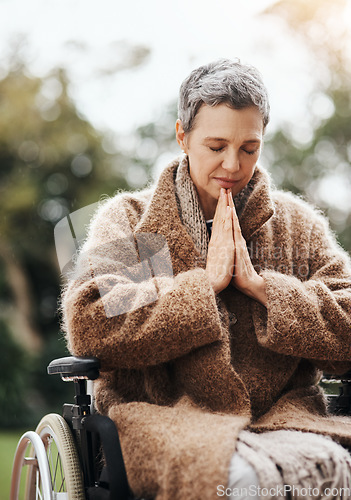 Image of Senior woman in wheelchair, praying in garden with worship and God, disability with gratitude and faith outdoor. Spiritual female person in nature with paralysis, disabled and prayer for guidance