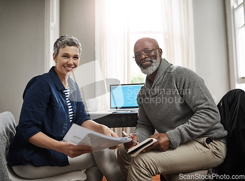 Image of Portrait, documents or finance with a senior couple busy on a budget review in the home together. Accounting, taxes or investment planning with a mature man and woman looking at insurance or savings