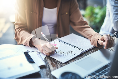 Image of Hands, writing and notebook with business woman, coffee shop and planning with notes, ideas or creativity. Businesswoman, pen and book with report, problem solving or remote work for proposal at cafe