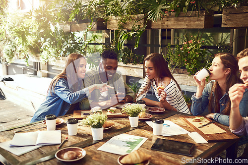 Image of Teamwork, restaurant and business people in meeting with phone for internet, social networking and website. Coffee shop, lunch and men and women chatting for discussion, planning and strategy