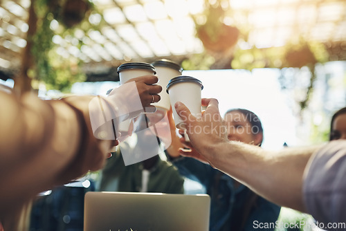 Image of Collaboration, cheers and team with coffee in a meeting or discussion for a creative project in a cafe. Diversity, goals and professional employees with a latte for a toast to celebrate in restaurant