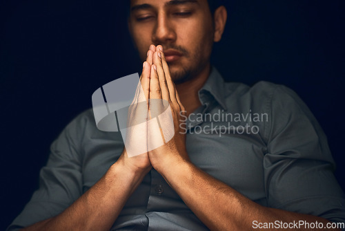 Image of Pray, worship and man with praying hands in studio for hope, faith and religious guidance. Palms, prayer and male person with gesture for faith, God and gratitude to Jesus for help, trust and belief