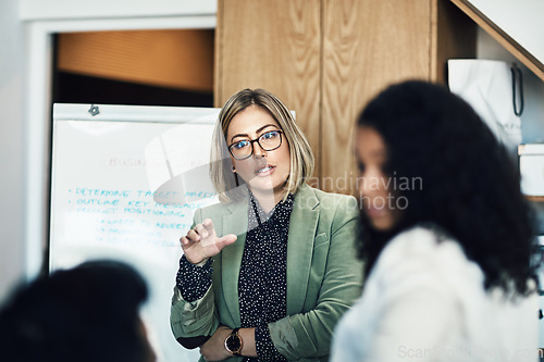 Image of Presentation meeting, audience and business woman brainstorming, planning and talking to listening strategy team. Project management, collaboration and manager speech, report or discussion with group