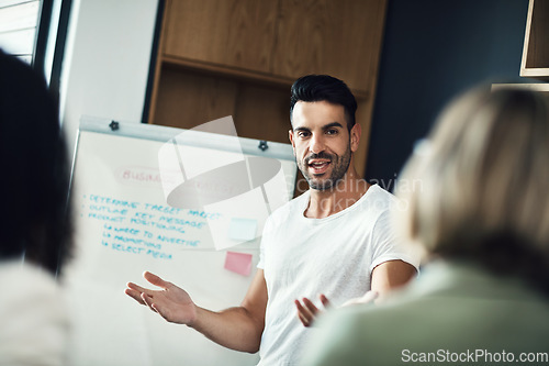 Image of Presentation meeting, whiteboard and man explain strategy, business plan or brainstorming ideas, coaching or teaching team. Group mentor, coach or startup leader speaking to creative design staff