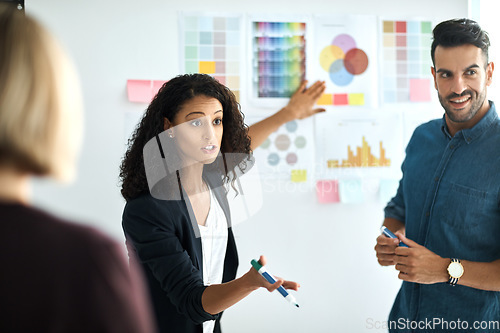 Image of Presentation board, meeting and diversity business people planning, teamwork or brainstorming creative design. Designer, agency collaboration and cooperation team explain color choice, plan or ideas