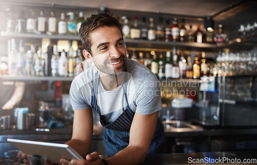 Image of Smile, thinking and a barista with a tablet at a cafe for online orders and communication. Happy, ideas and a male pub manager or bartender with technology for an app, connection and ordering stock