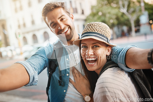 Image of Tourist selfie, happy couple and outdoor for travel on a city street for happiness and holiday memory. Face of a man and a woman laughing on urban road for adventure, journey or vacation for freedom