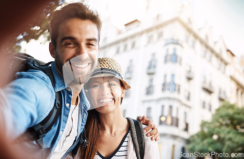 Image of Selfie, tourist couple and outdoor in a city for travel on a street with a happy smile. Man and woman together for summer holiday memory on urban road for adventure, journey and vacation or freedom