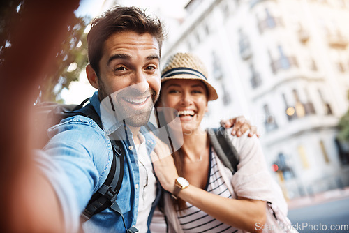 Image of Tourist couple, happy and selfie for travel on a city street with a partner for holiday memory. Face of a man and woman outdoor on urban road for adventure, journey or vacation for freedom and relax