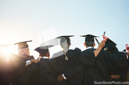 Image of Group, students and graduation for college or university friends together with blue sky mockup. Men and women outdoor to celebrate education achievement, success and future at event for graduates