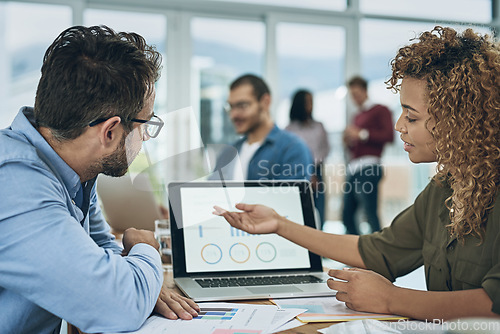 Image of Laptop, finance and graph with a business team doing research together in their office for planning. Computer data or chart with a man employee and woman colleague meeting to discuss strategy