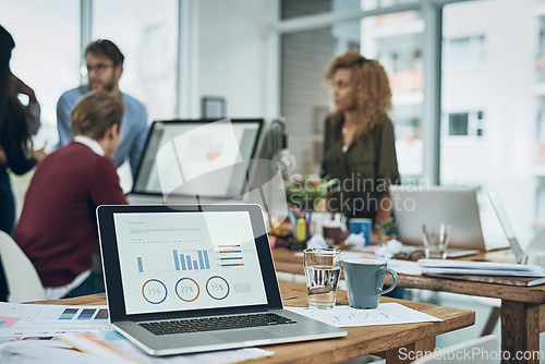 Image of Digital data, office and laptop with graphs for business, trading and financial work. Coworking, technology and a computer screen with stats, data and information on the economy or growth of company