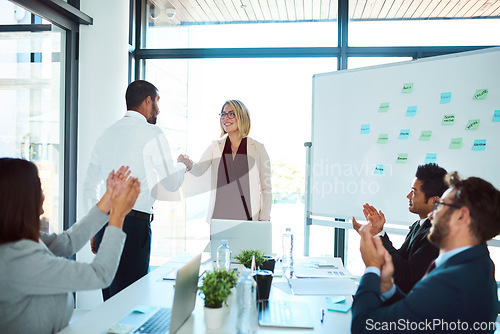 Image of Professional, handshake and agreement in a meeting to congratulate for success and an opportunity. Presentation, applause and business people with collaboration for partnership with teamwork.