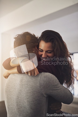 Image of Happy woman hugging man in home for love, care and quality time together. Young couple, hug and romance of lovers in intimate relationship, special moment and smile for trust of partner in apartment