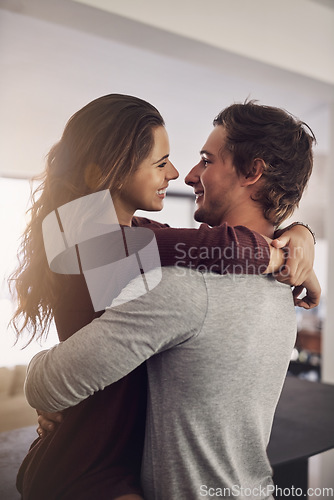 Image of Woman, man and hug for love, care and quality time together with commitment to relationship at home. Happy young couple, hugging and romance of lovers, smile and relax with trust of partner in house