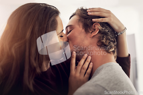 Image of Face, couple and kiss for love, care and intimate moment for anniversary, honeymoon and bonding together at home. Happy young man, woman and kissing with passion, romance and lovers in relationship