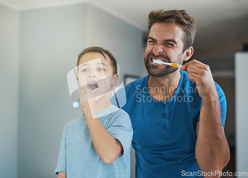 Image of Happy, brushing teeth and father with son in bathroom for morning routine, bonding and dental. Oral hygiene, cleaning and smile with man and child in mirror of family home for self care and wellness